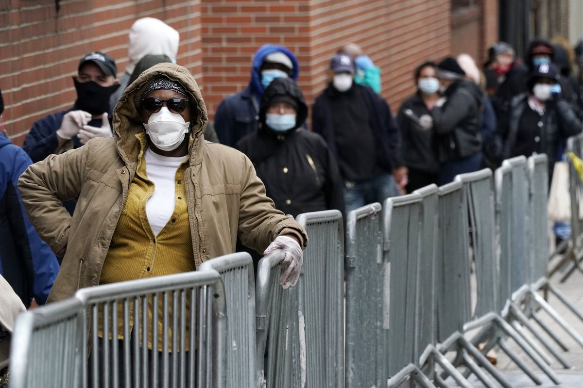 Migrants who crossed the border from Mexico into Texas exit a bus as it arrives into the Port Authority bus station in Manhattan on August 25, 2022 in New York City.