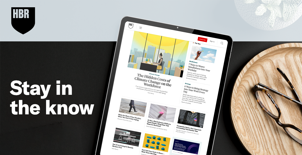 A tablet with the HBR site on it, next to a pair of glasses with the copy, stay in the know.