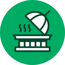 Icon of a steaming covered dish on a serving tray inside a green circle.