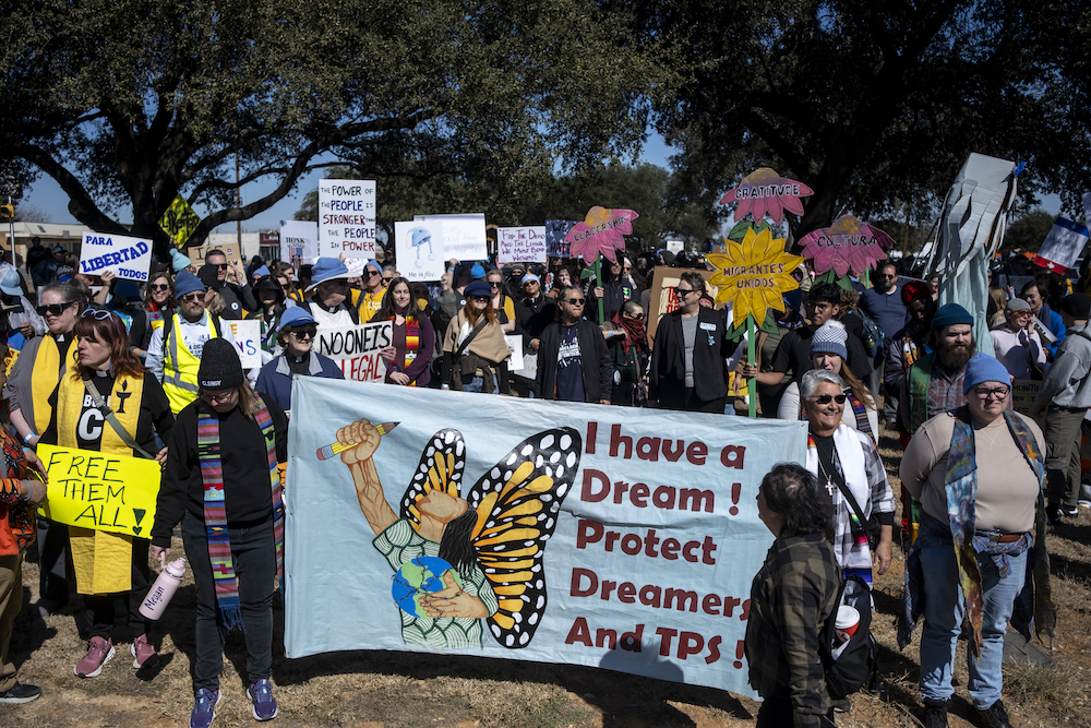 People gather in protest against Immigration and Customs Enforcement before marching toward the South Texas Family Residential Center on January 28, 2026 in Dilley, Texas. 