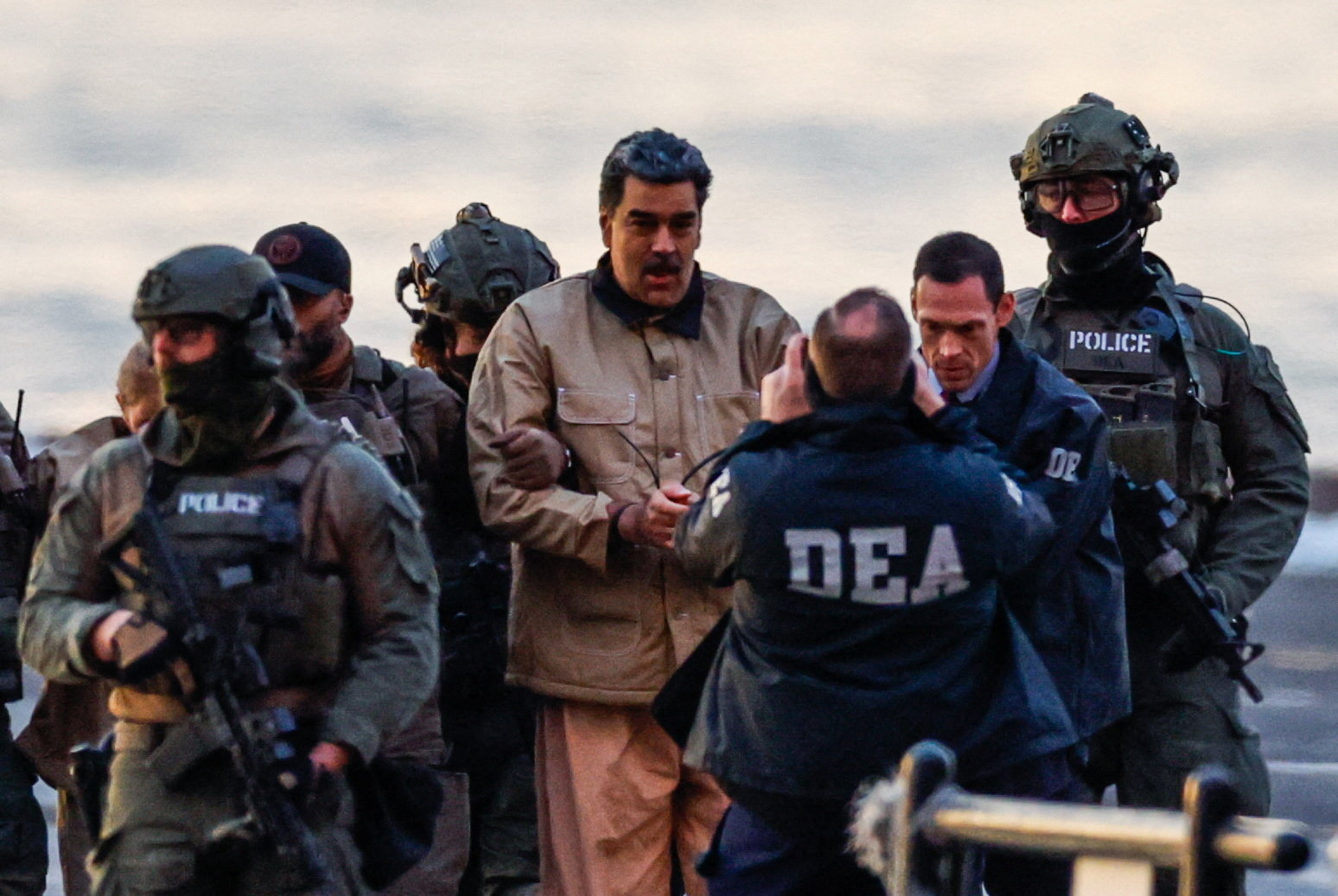 Hesham Badawi, a Palestinian, carries debris from armoured personnel carriers next to destroyed buildings after Israeli military operations in Gaza City.
