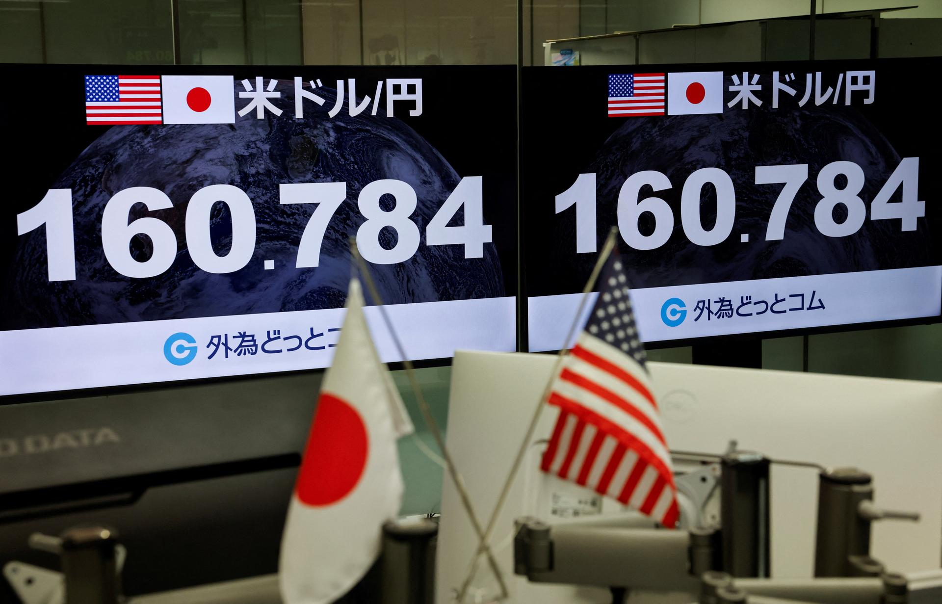 Monitors at a foreign exchange dealing room in Tokyo.