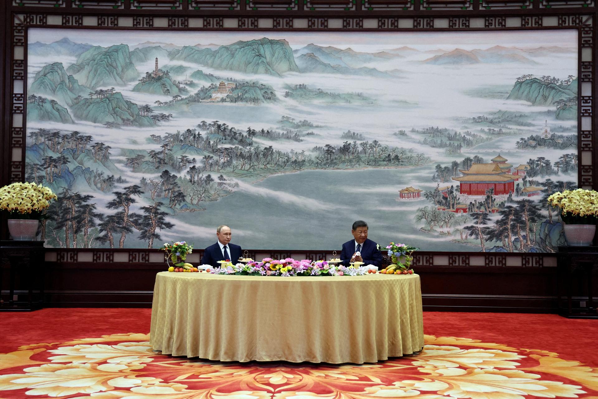 Russian President Vladimir Putin and Chinese President Xi Jinping attend a meeting in Beijing