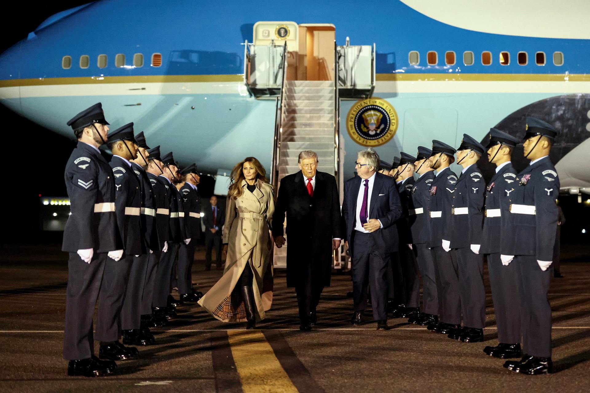  President Donald Trump walks with Melania Trump and Viscount Henry Hood upon arrival at London Stansted Airport. REUTERS/Kevin Lamarque