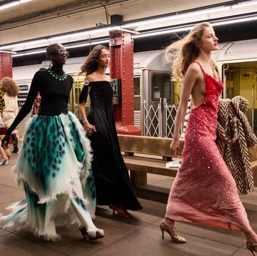 models walking through NYC subway platform