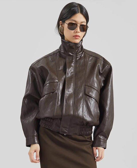 Model wearing a funnel neck jacket