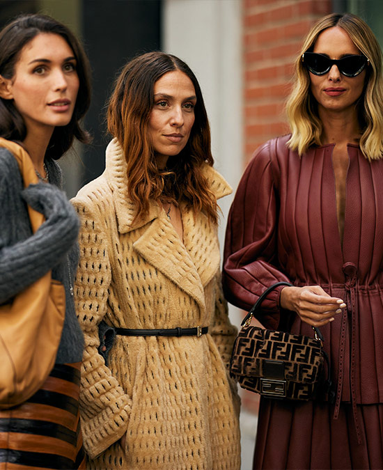 Street style image of three women in autumnal clothing