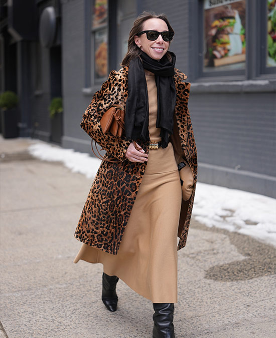 Katie Holmes wearing boots and jeans