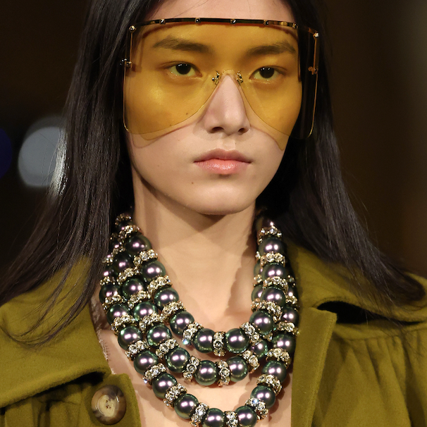 Yellow sunglasses and chunky jewelry for fall