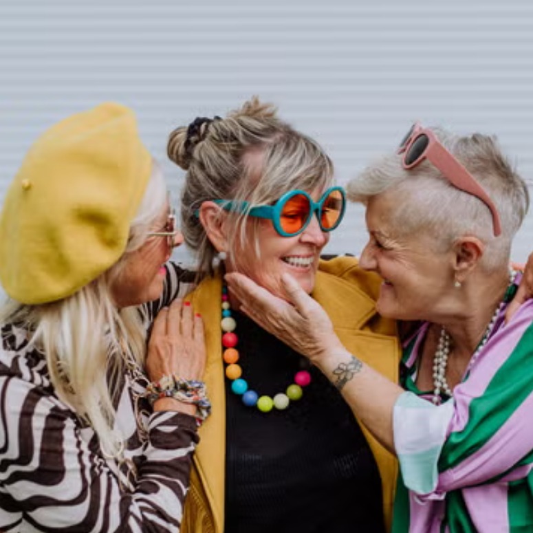 Women smiling and talking to each other