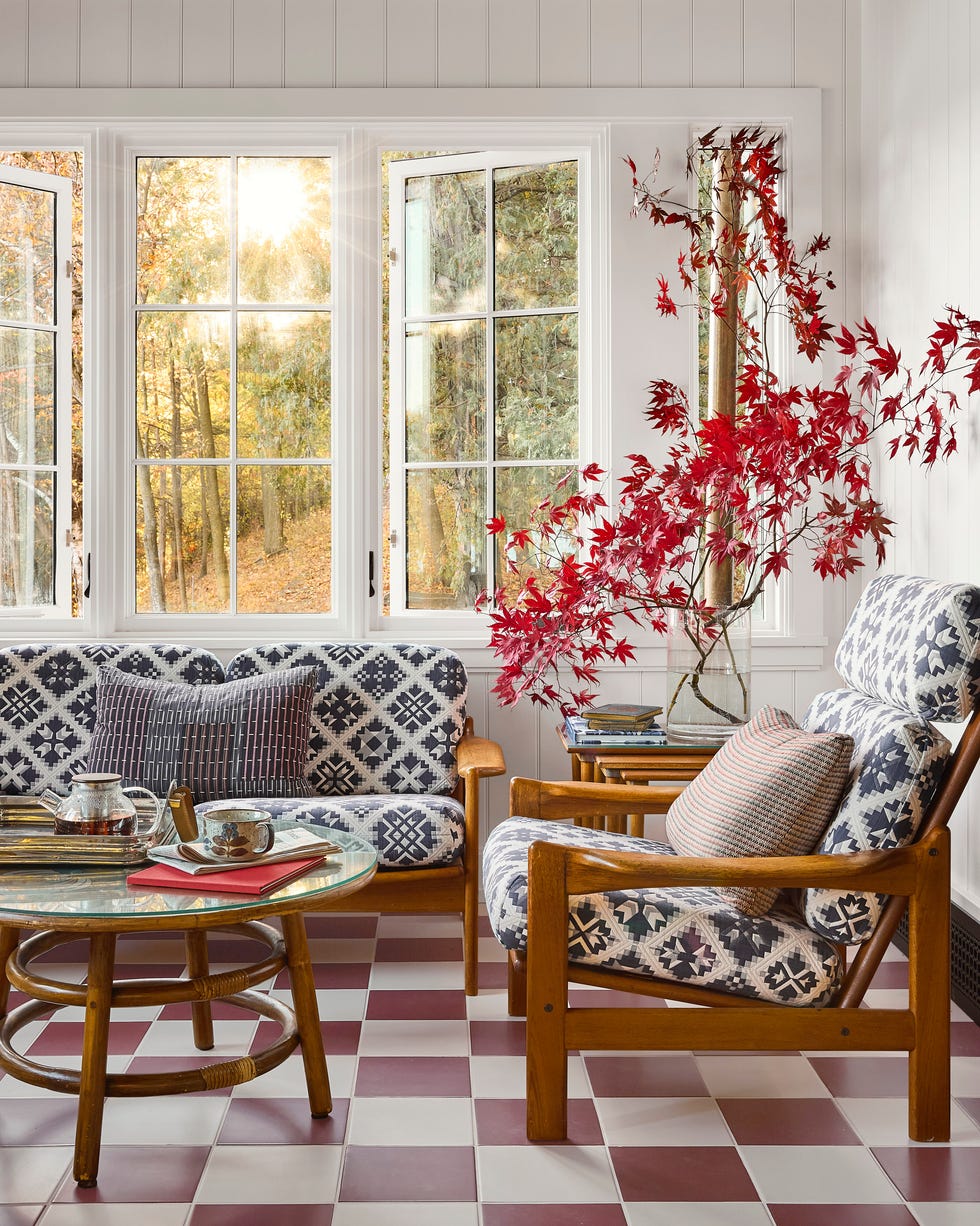 enclosed porch with checkboard floor, cozy seating