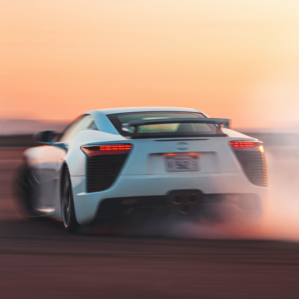 White Lexus driving fast