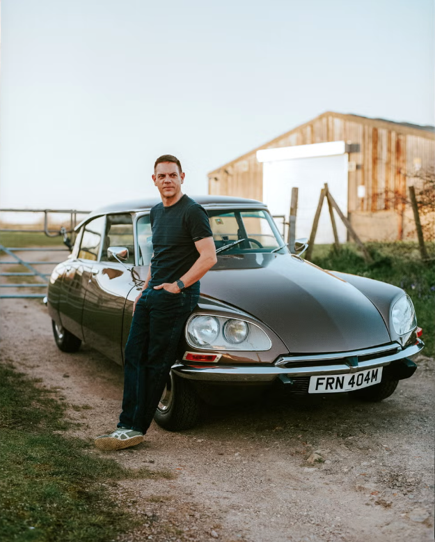 Jethro Bovingdon standing next to car