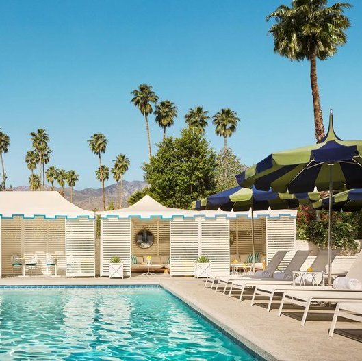 pool, cabanas, and chairs