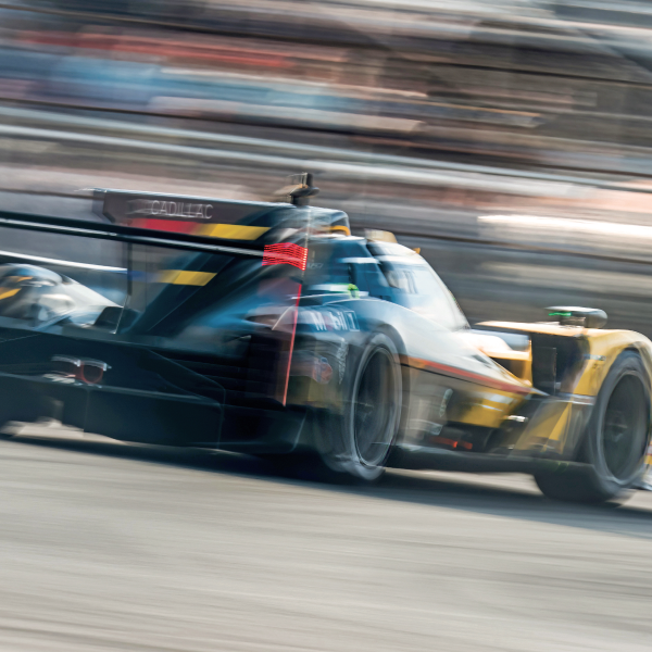 Cadillac race car driving fast
