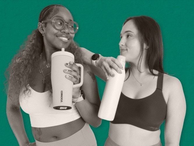 Two editors holding water bottles looking at each other