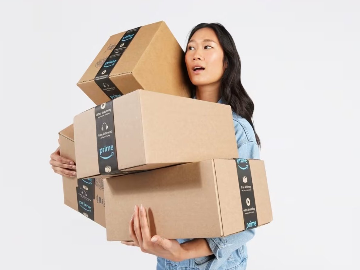 person in red dress with open amazon box