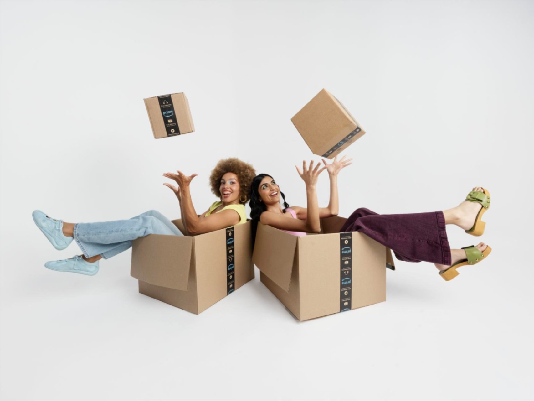 person in red dress with open amazon box