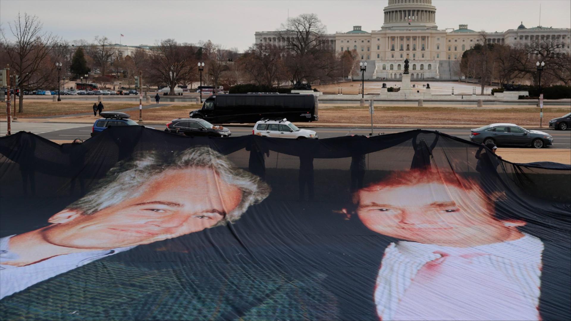  A photo of Donald Trump and Jeffrey Epstein is unfurled on the National Mall near the U.S. Capitol