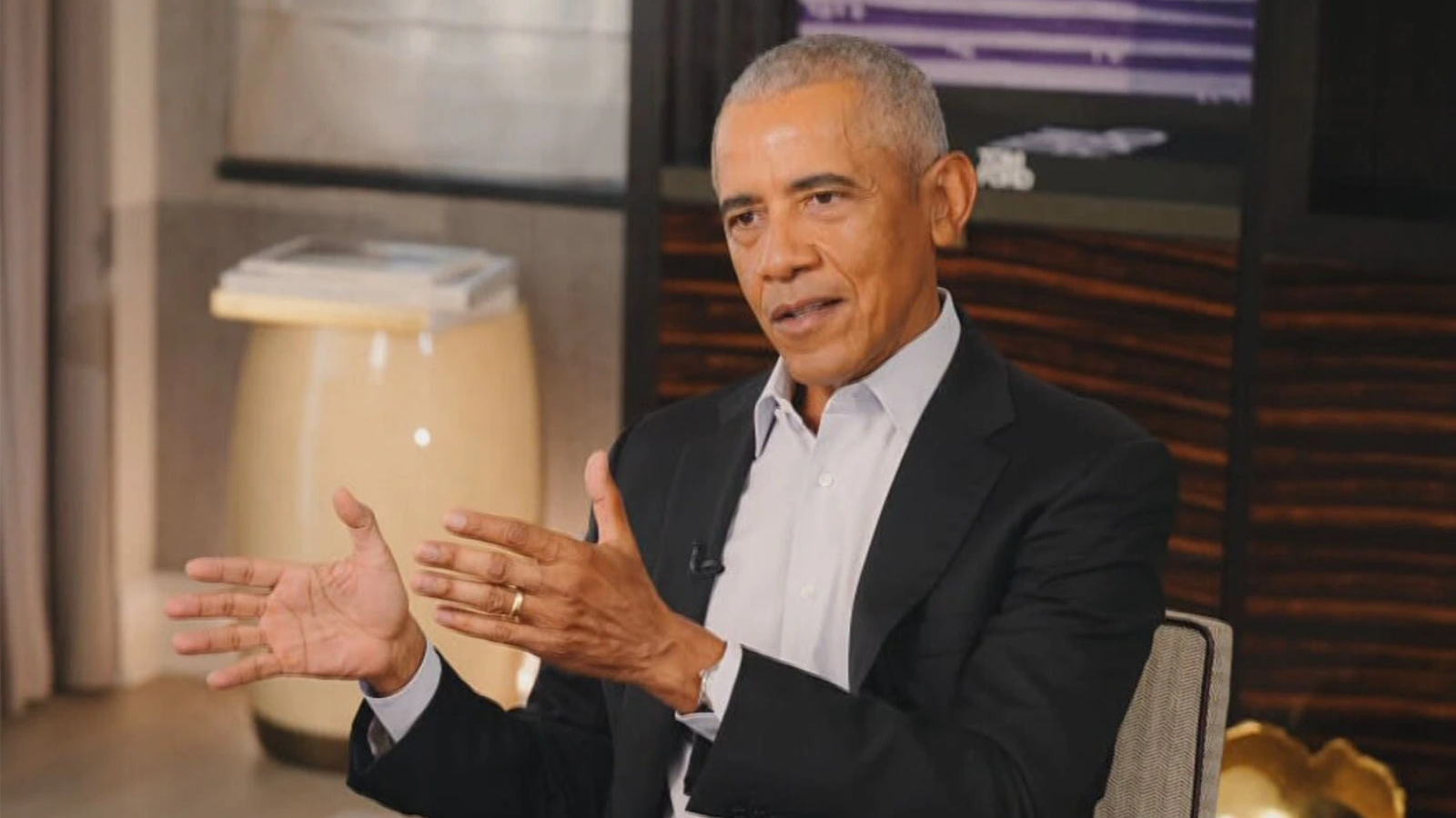 Barack Obama gestures with his hands.