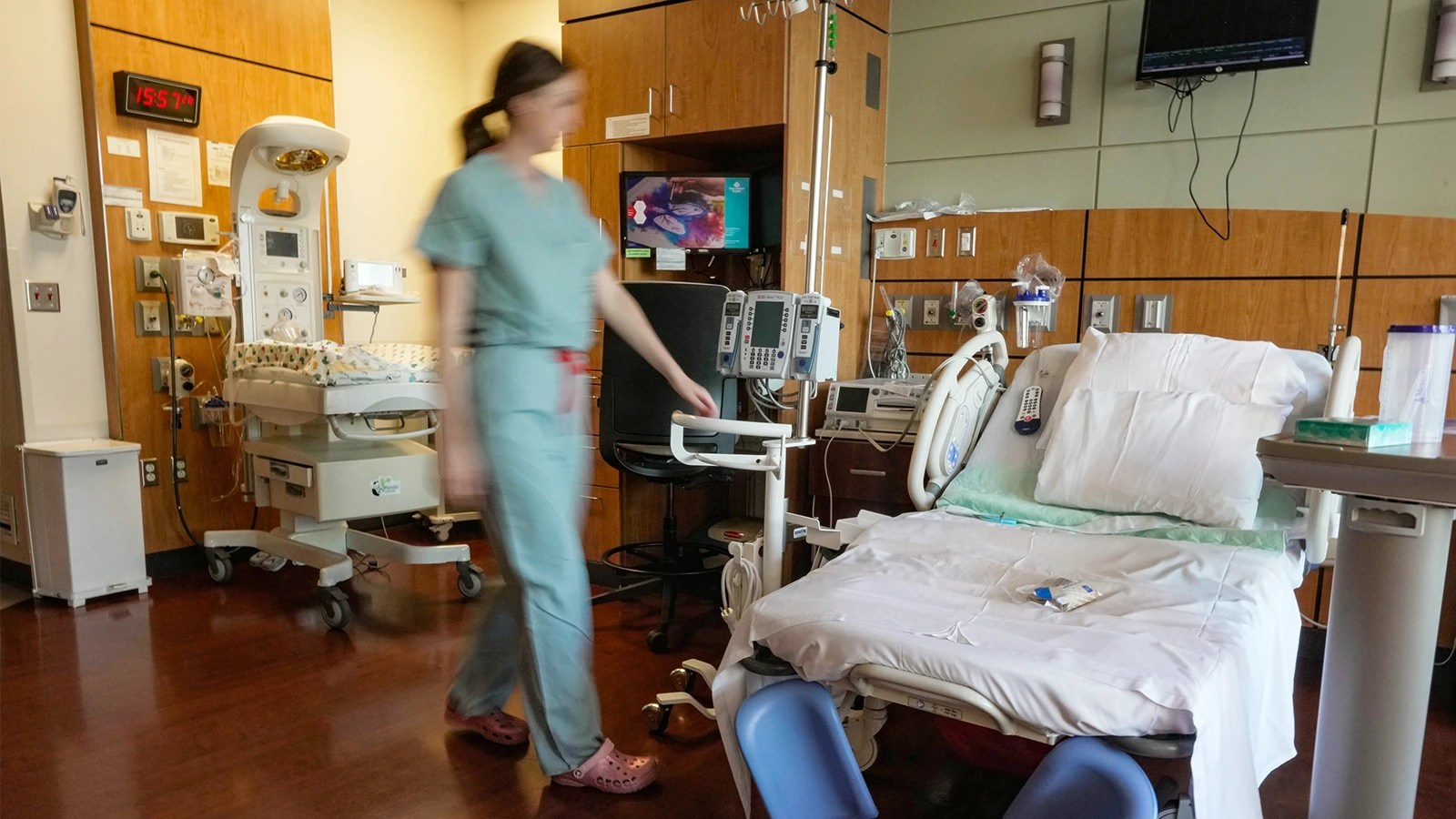 Nurse next to hospital bed