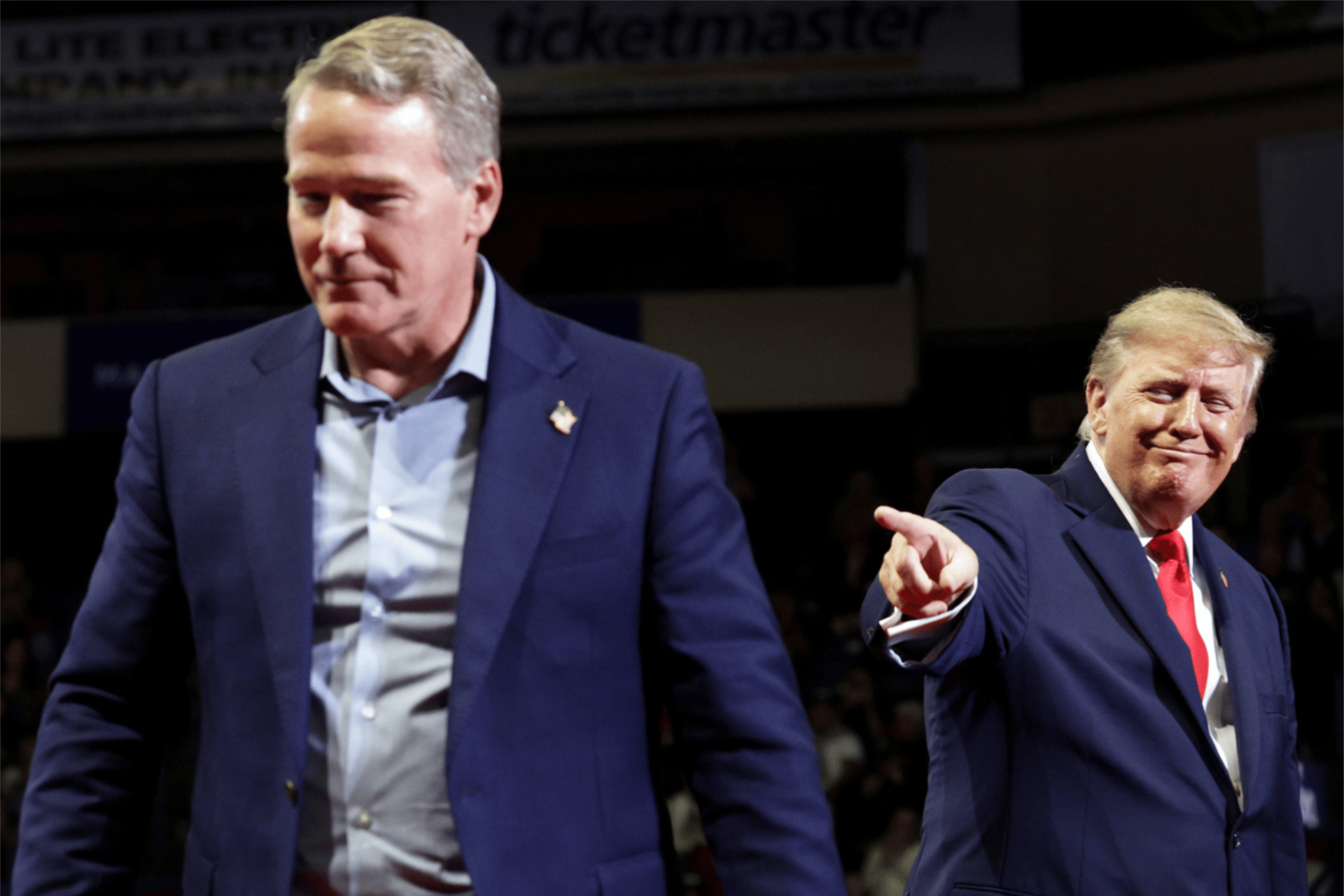 Donald Trump gestures towards Sen. Jon Husted during an election rally.