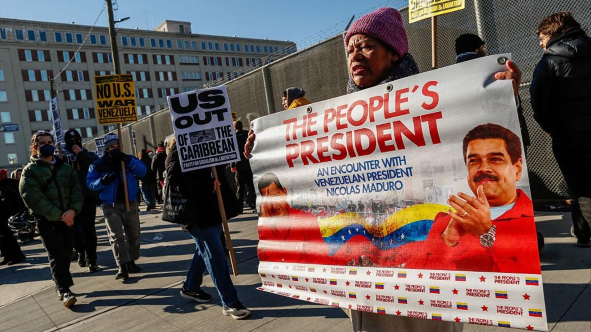 Protester holds sign featuring Maduro outside of Brooklyn courthouse
