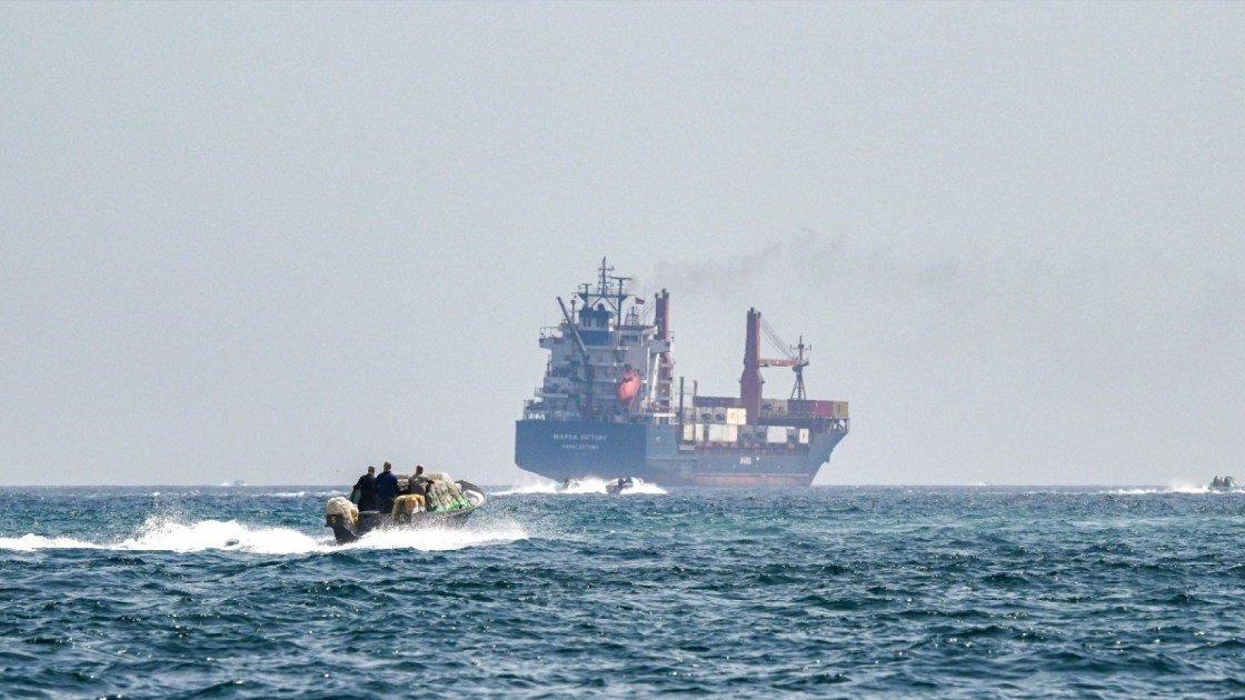 A photo of a cargo ship on the ocean