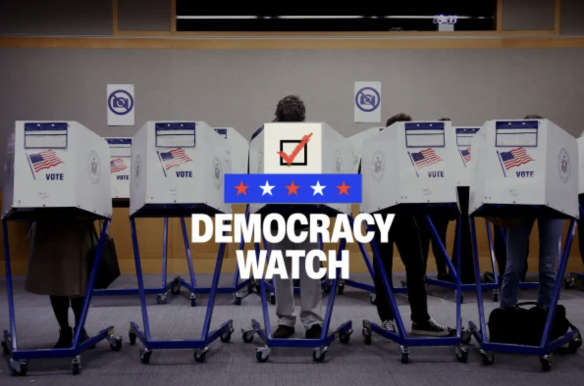 A person submits their ballot
