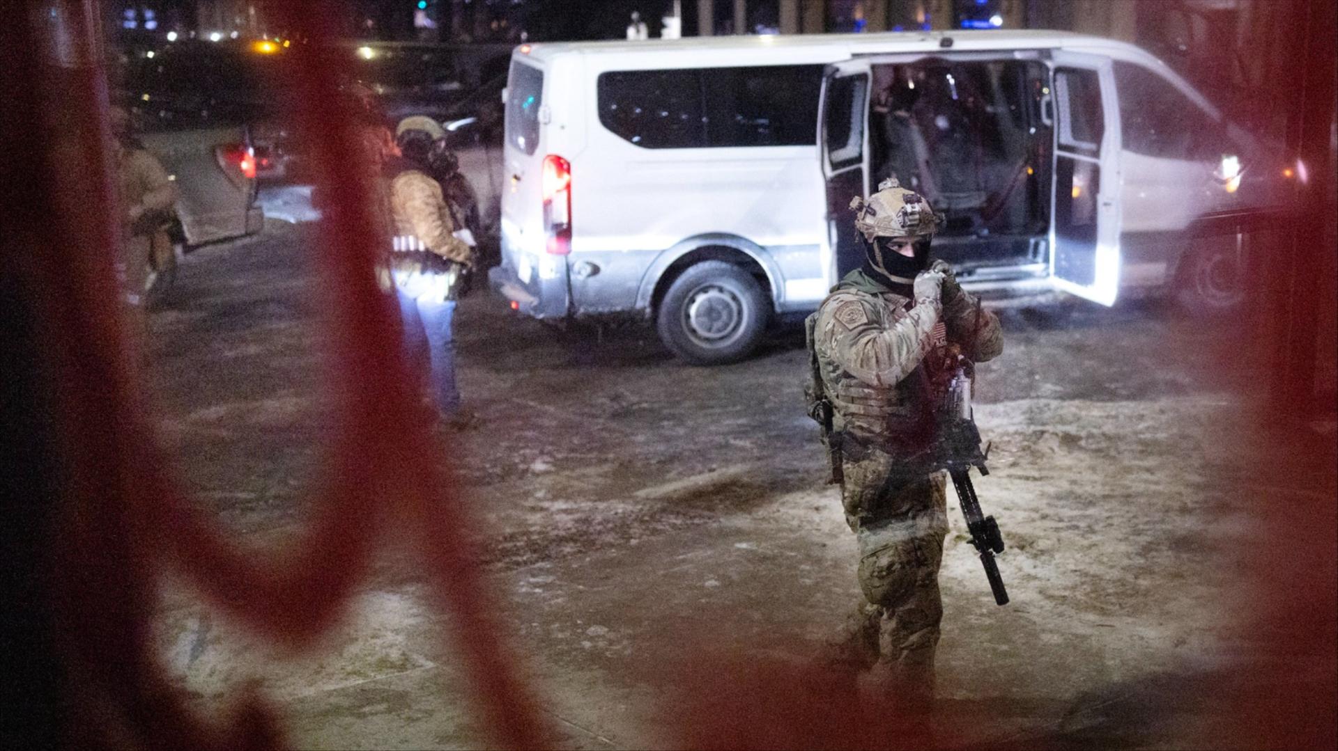 Federal agents break up a protest outside a hotel in Minneapolis