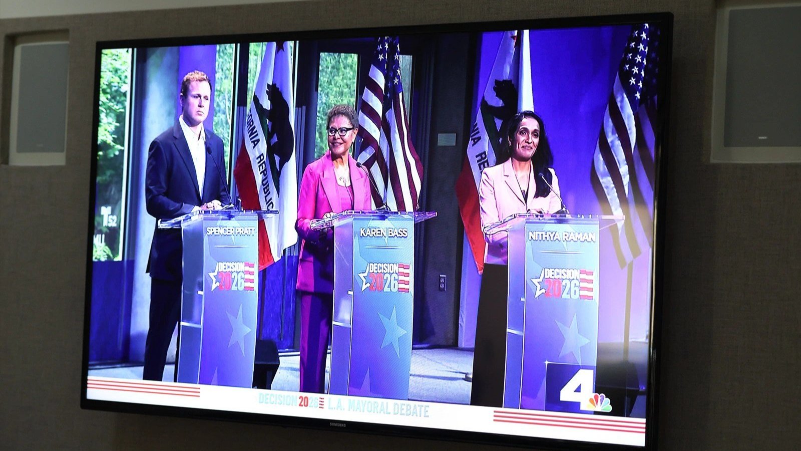 A TV showing Karen Bass, Nithya Raman and Spencer Pratt
