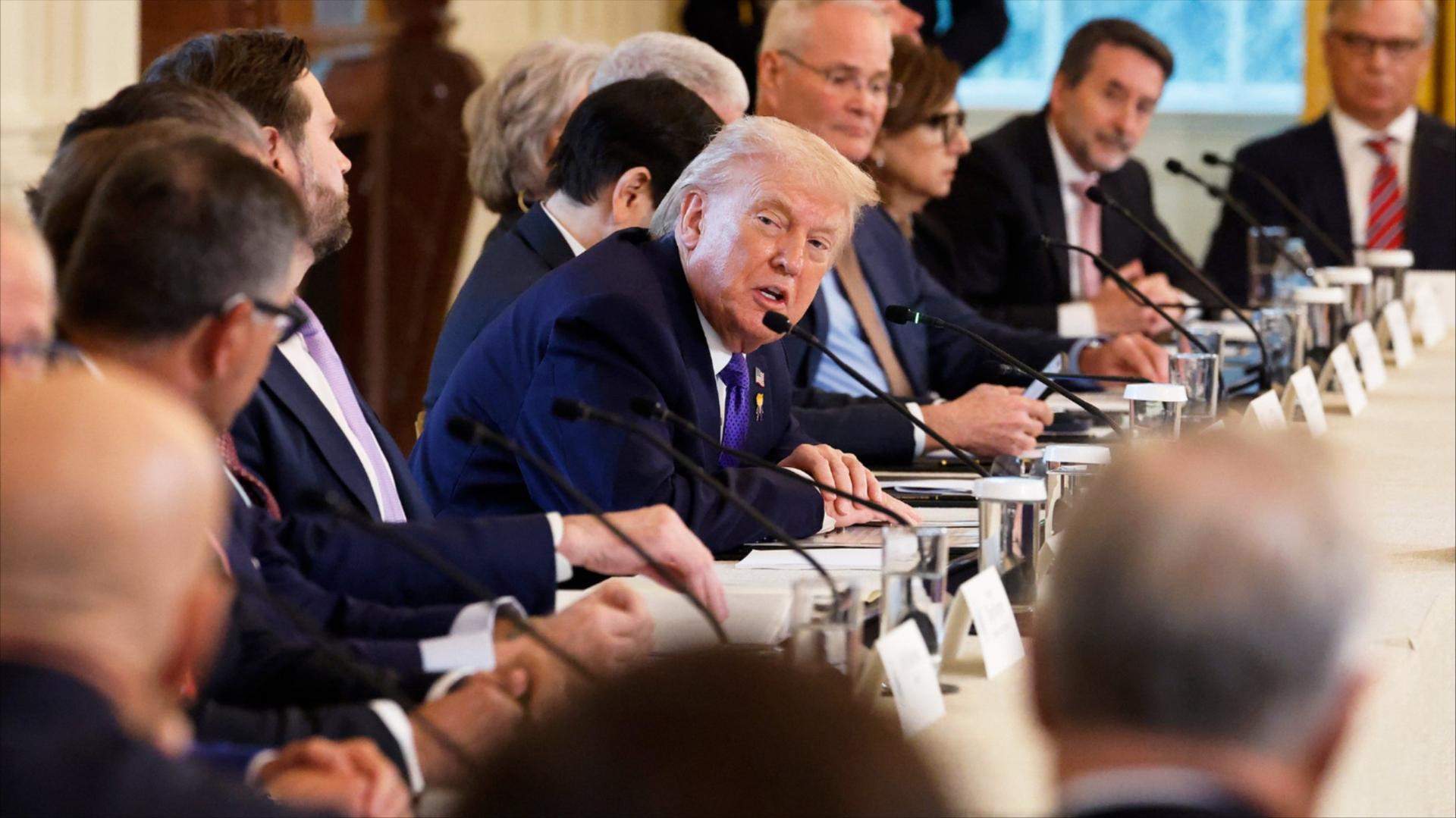 Donald Trump seated at a table with oil and gas executives.