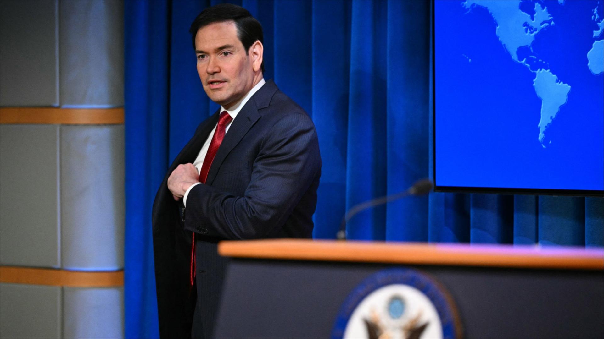 Marco Rubio arrives to speak during an end-of-year press conference