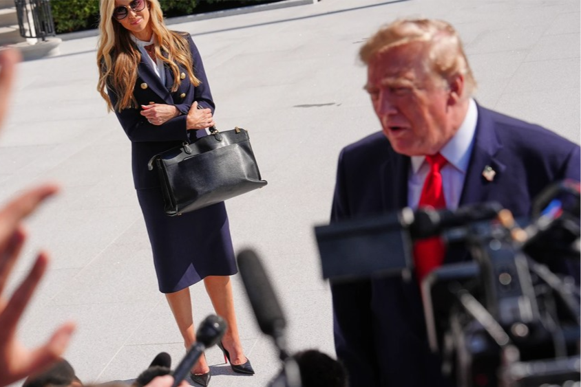 President Donald Trump speaks to the reporters as he walks to board Marine One Oct. 13, 2026, on the South Lawn of the White House.