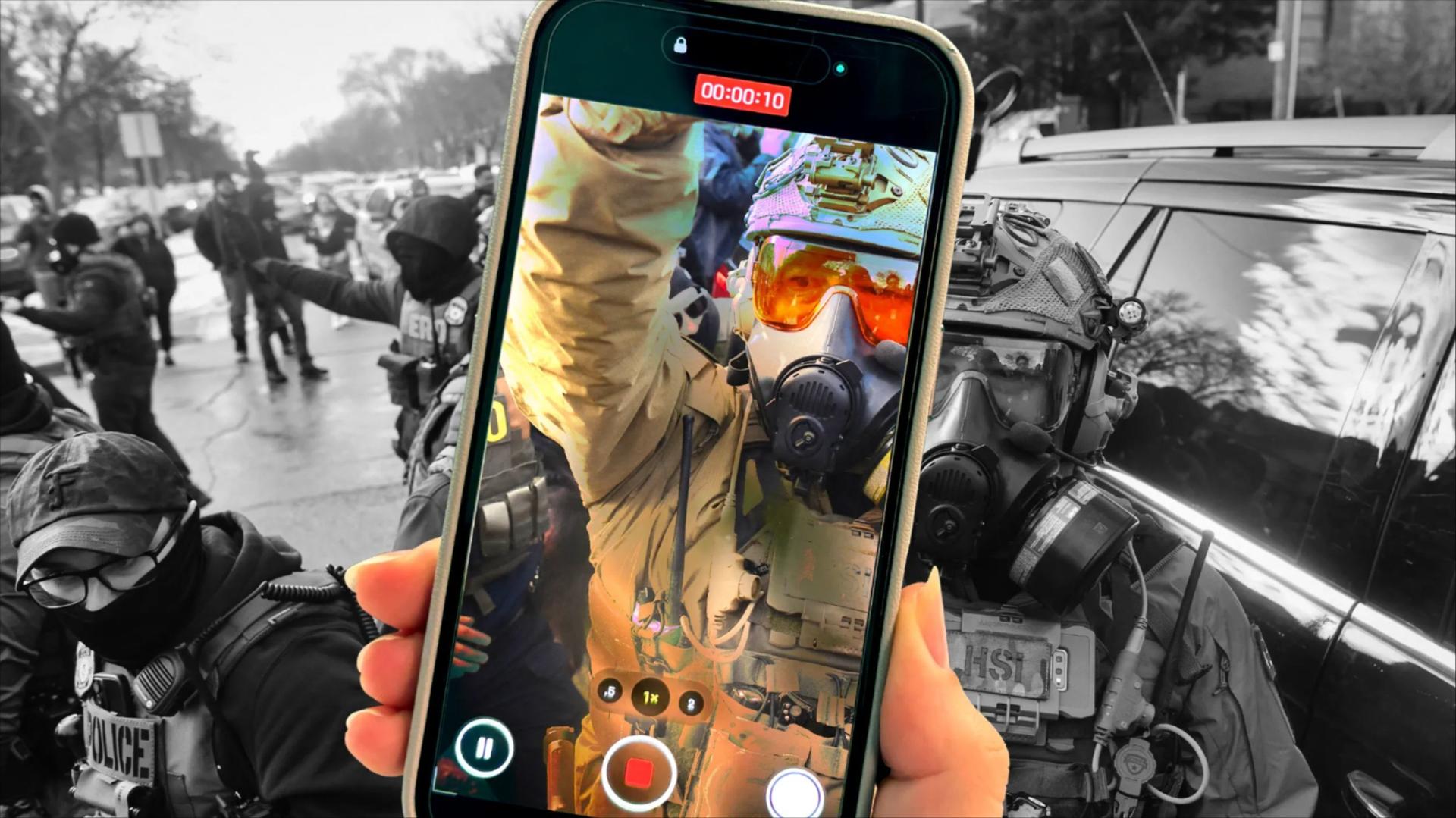 A photo illustration of a person holding an iPhone while filming an ICE agent