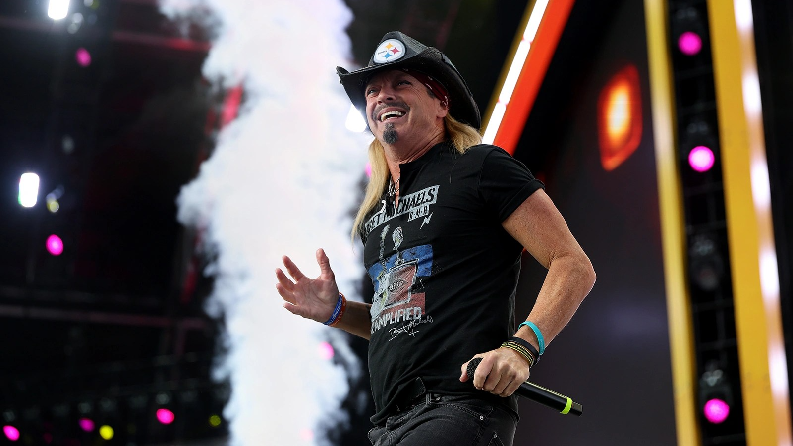 Bret Michaels smile on stage.