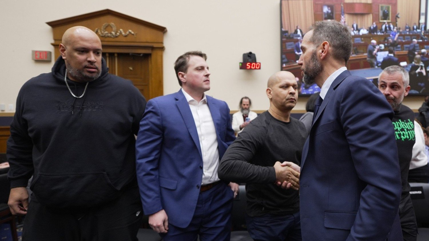 Harry Dunn and other former officers next to special counsel Jack Smith