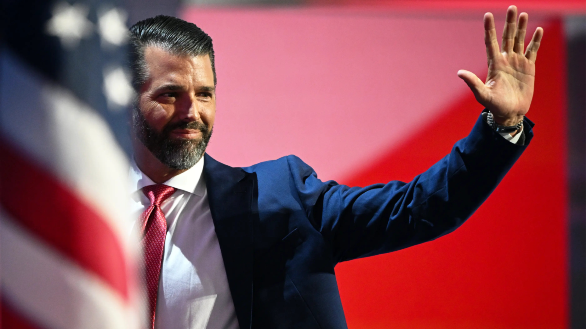 Donald Trump Jr. waves from RNC stage