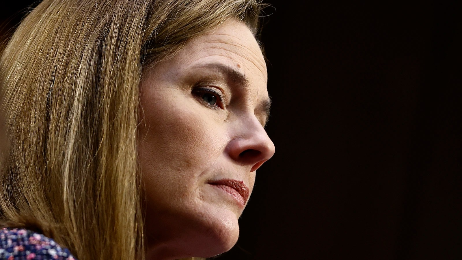 Amy Coney Barrett seen close up from a low angle.