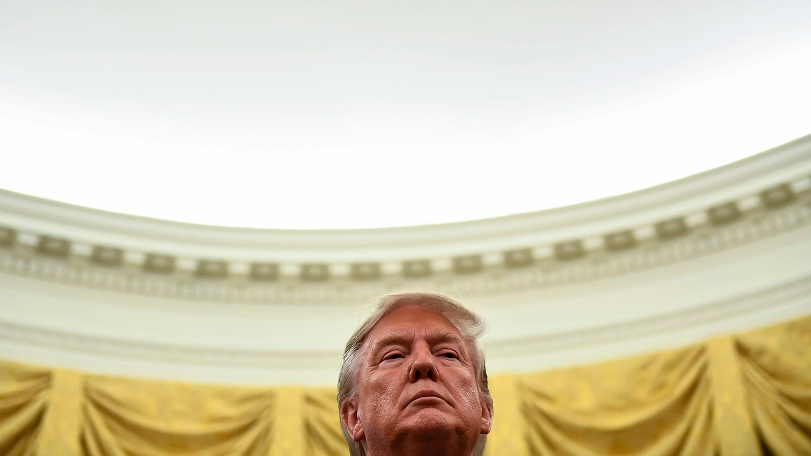 A photo of Trump’s head against a ceiling 