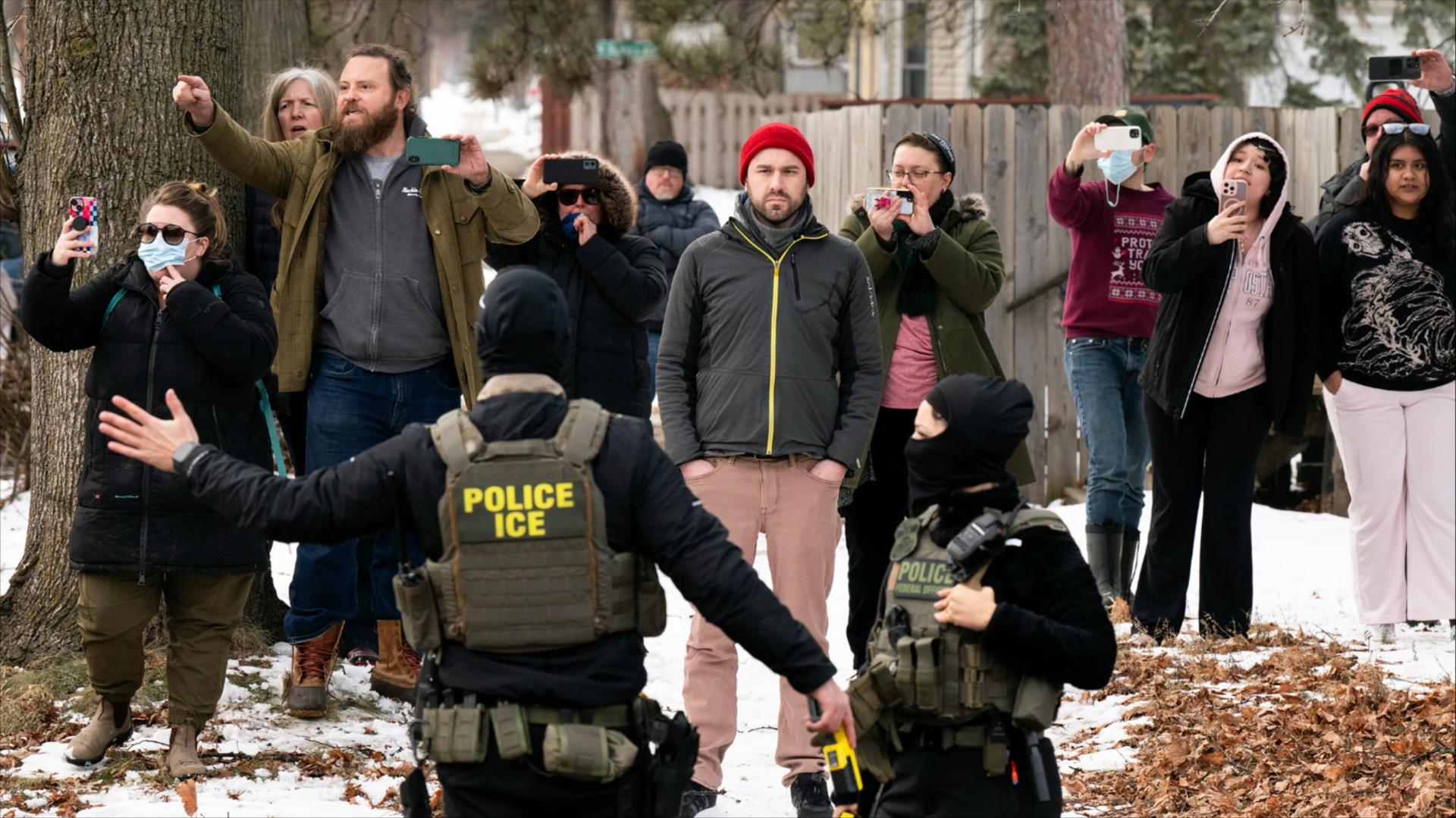 Observers film ICE agents