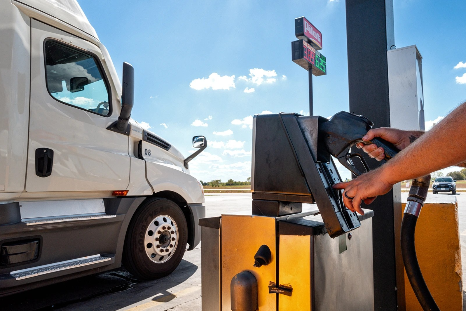 A person pumps diesel