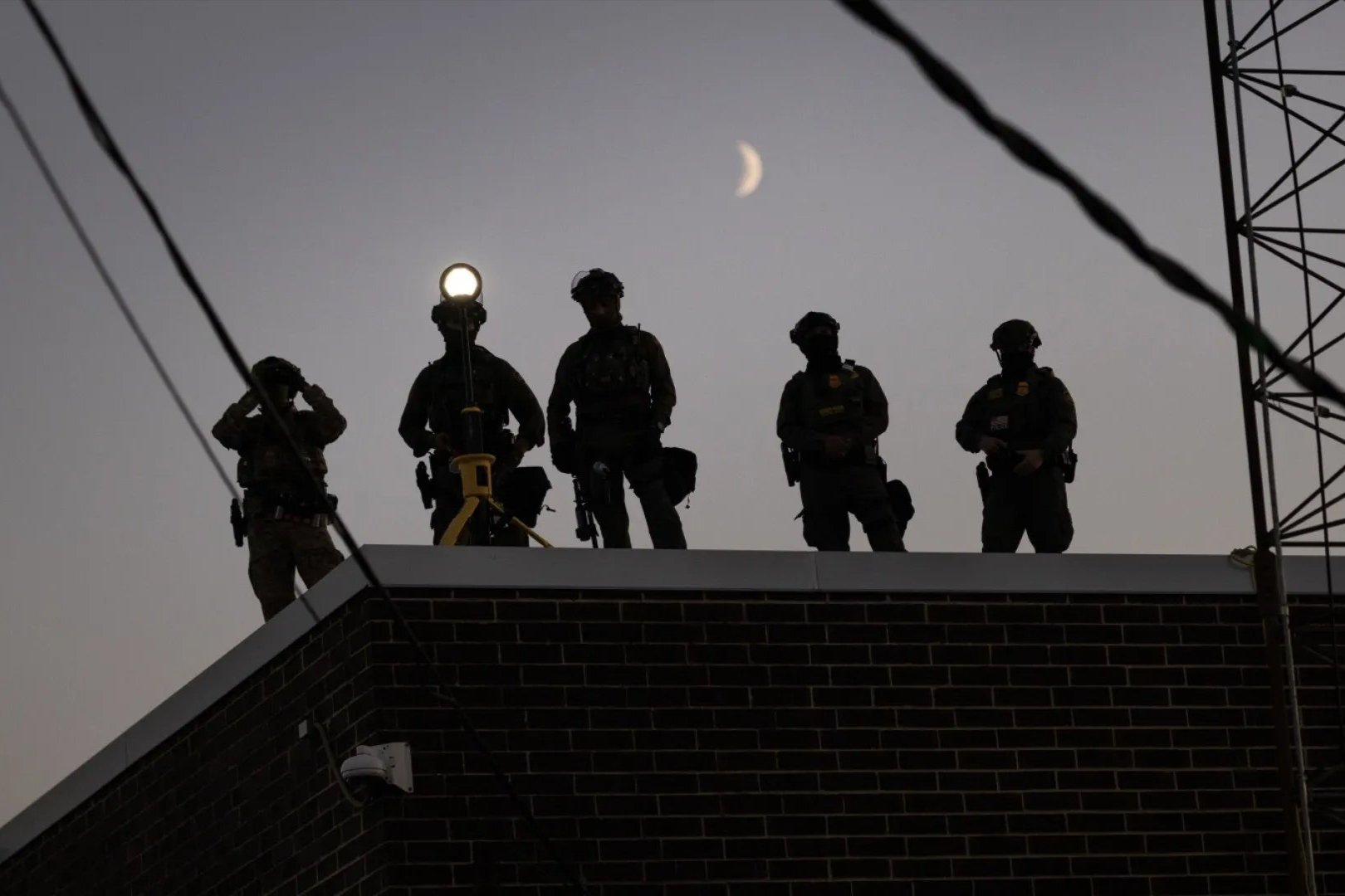 Photo of men on a structure 