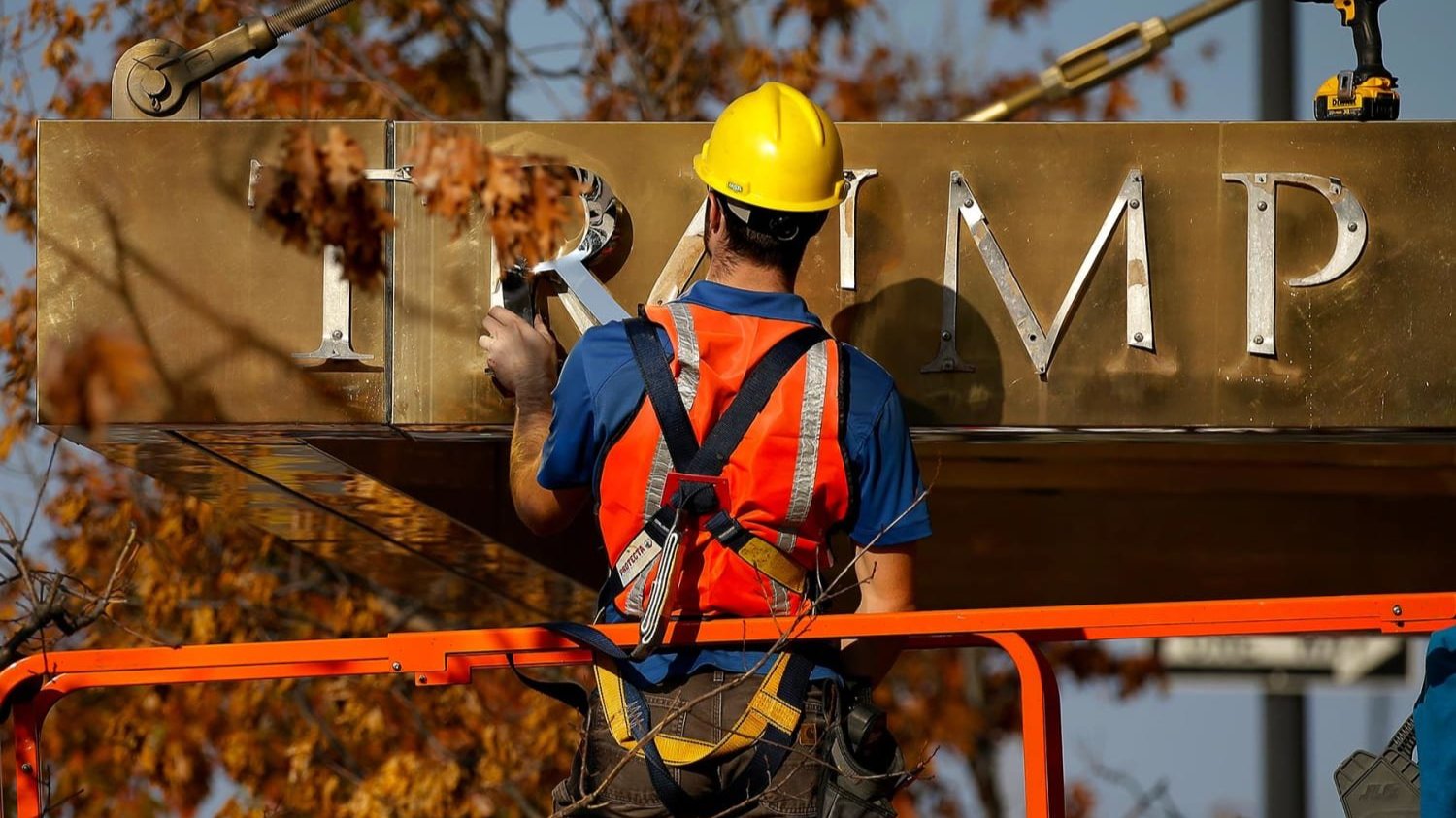 A worker removes the words 