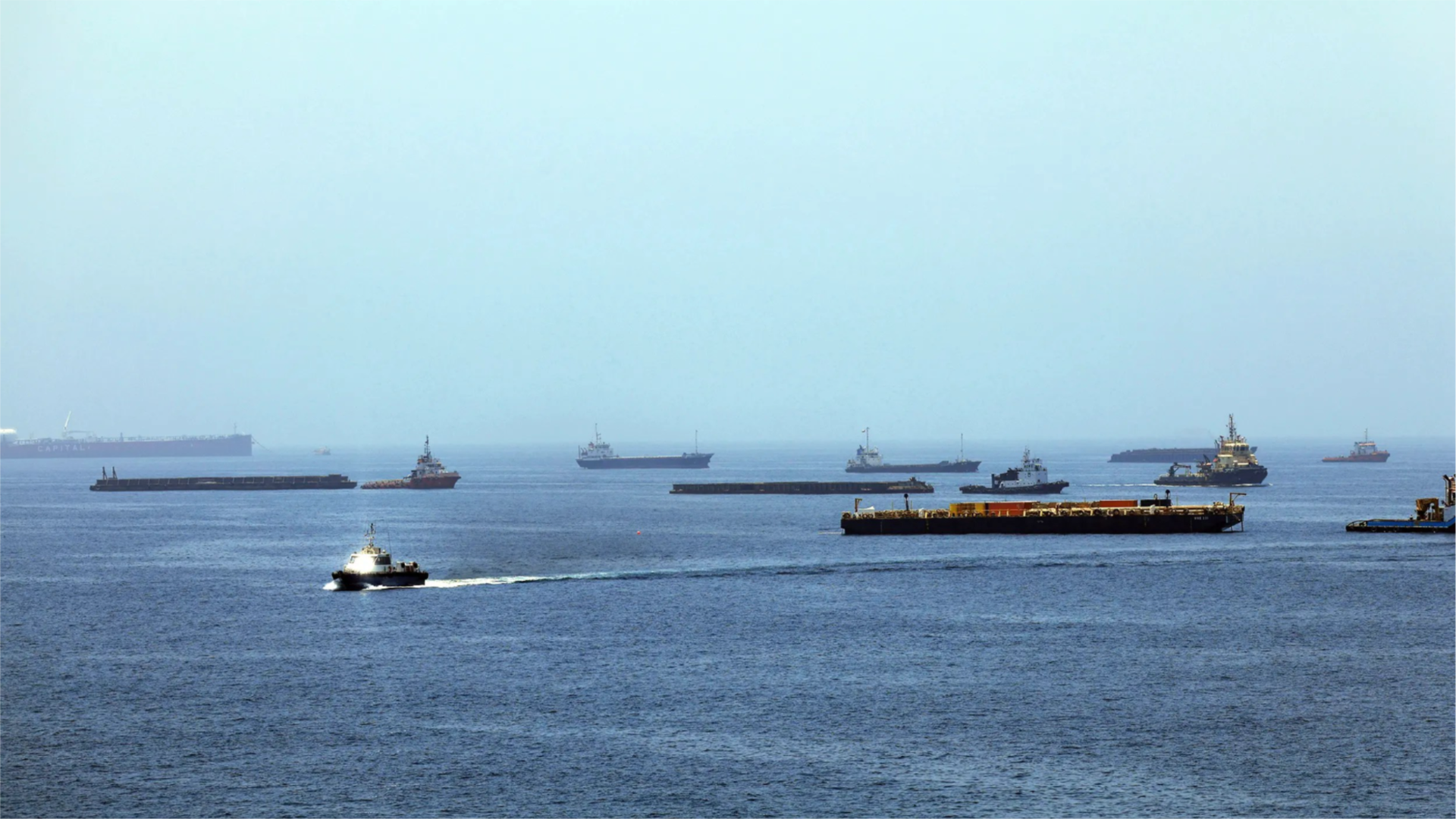  A view of commercial cargo vessels and crude oil tankers are anchored in the Gulf of Oman.