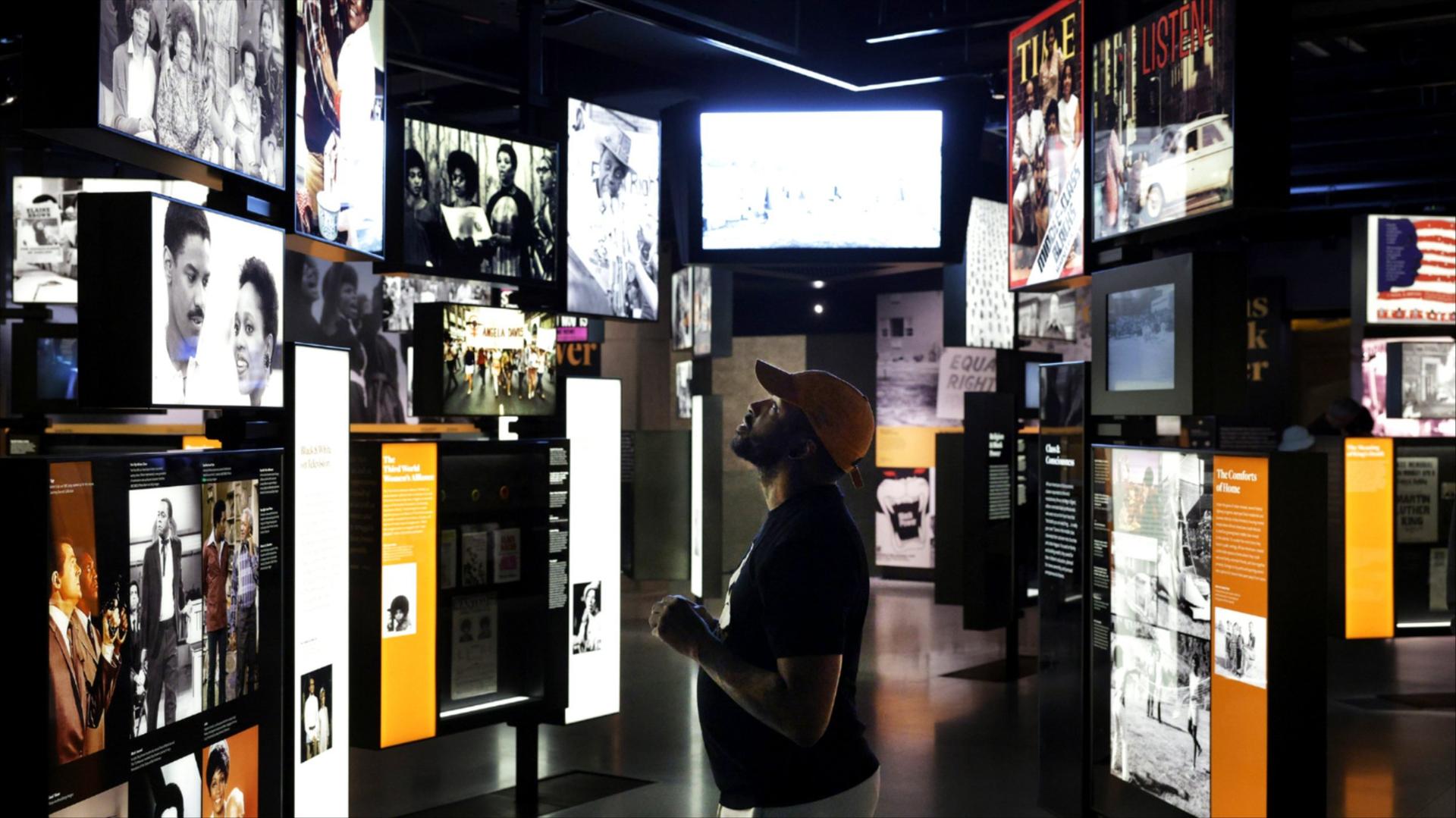A man looks at the screens at the Smithsonian National Museum of African American History