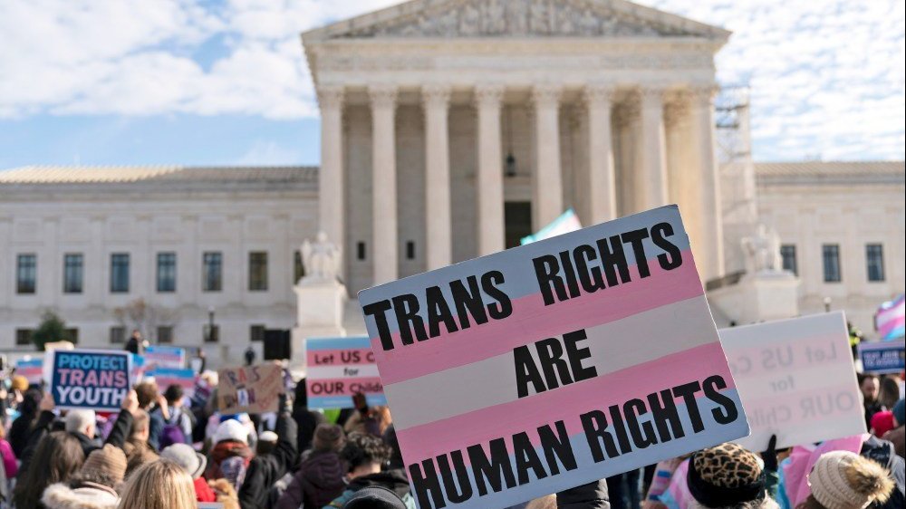 Trans rights supporters rally outside of the Supreme Court on Dec. 4, 2024