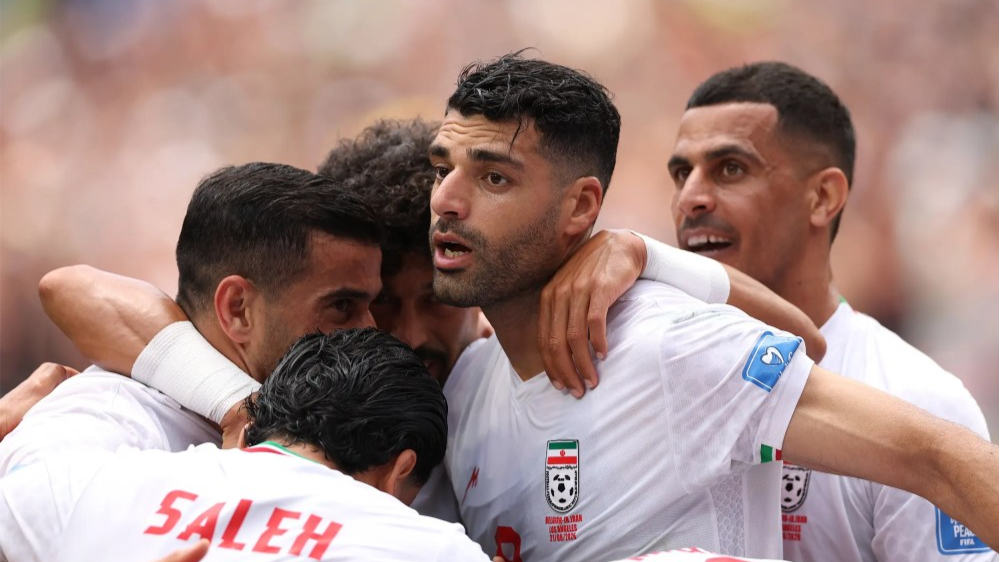 Mehdi Taremi #9 of Iran celebrates with team mates after scoring during the FIFA World Cup 2026 Group G match between Belgium and Iran on June 21, 2026 in Inglewood, Calif.