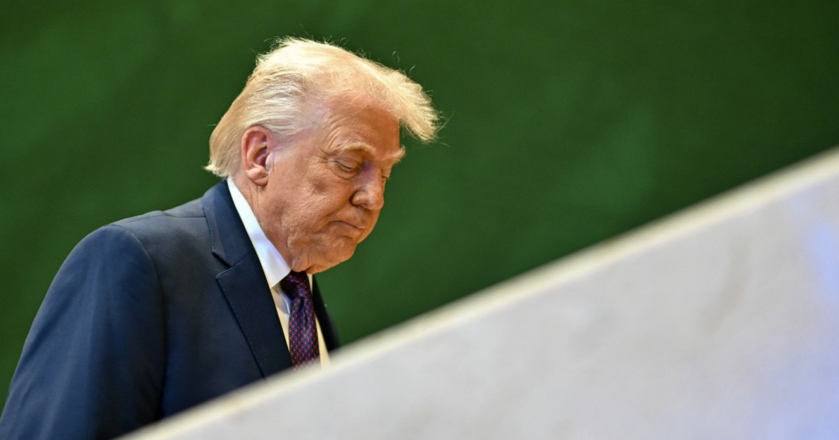  ICE agents standing in front of protester 