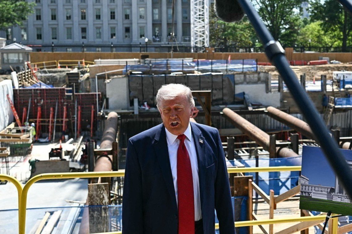 President Donald Trump in front of ballroom construction